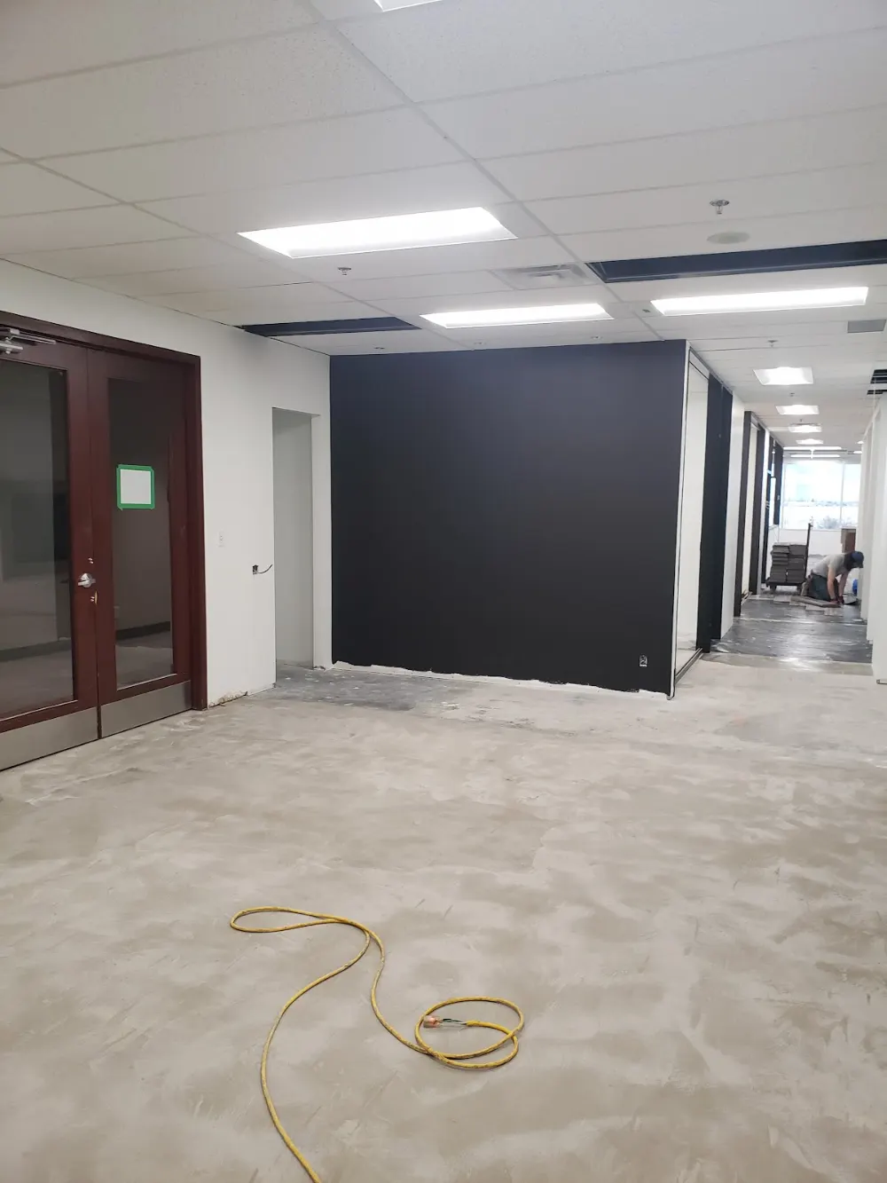 Office interior with a freshly painted dark accent wall